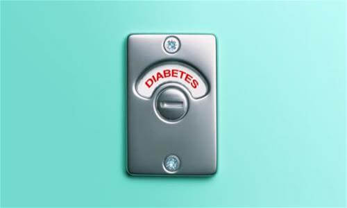 Silver-tone door occupancy indicator with the word diabetes shown in red